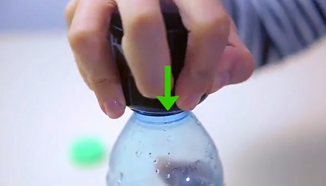 Push the bottle mouth through the sturdy aerosol cap